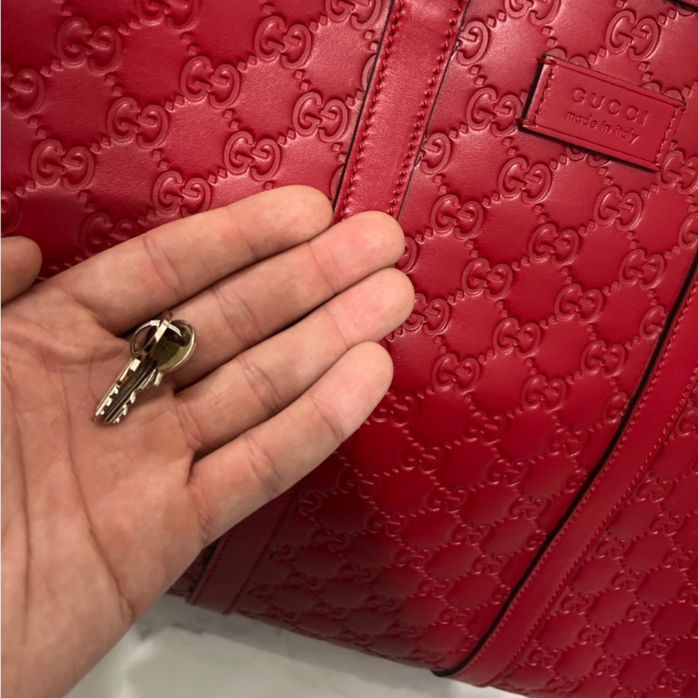 GG EMBOSSED LARGE DUFFLE BAG